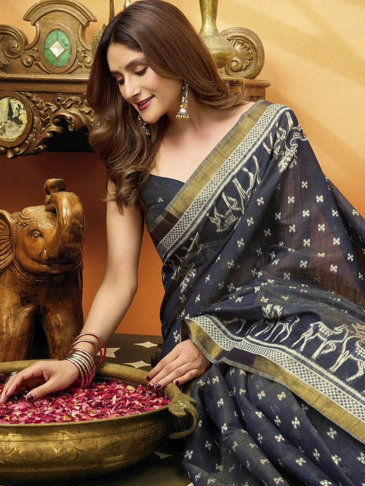 Tarani premium navy blue cotton saree closeup showing woven border jhallar and fabric detailing