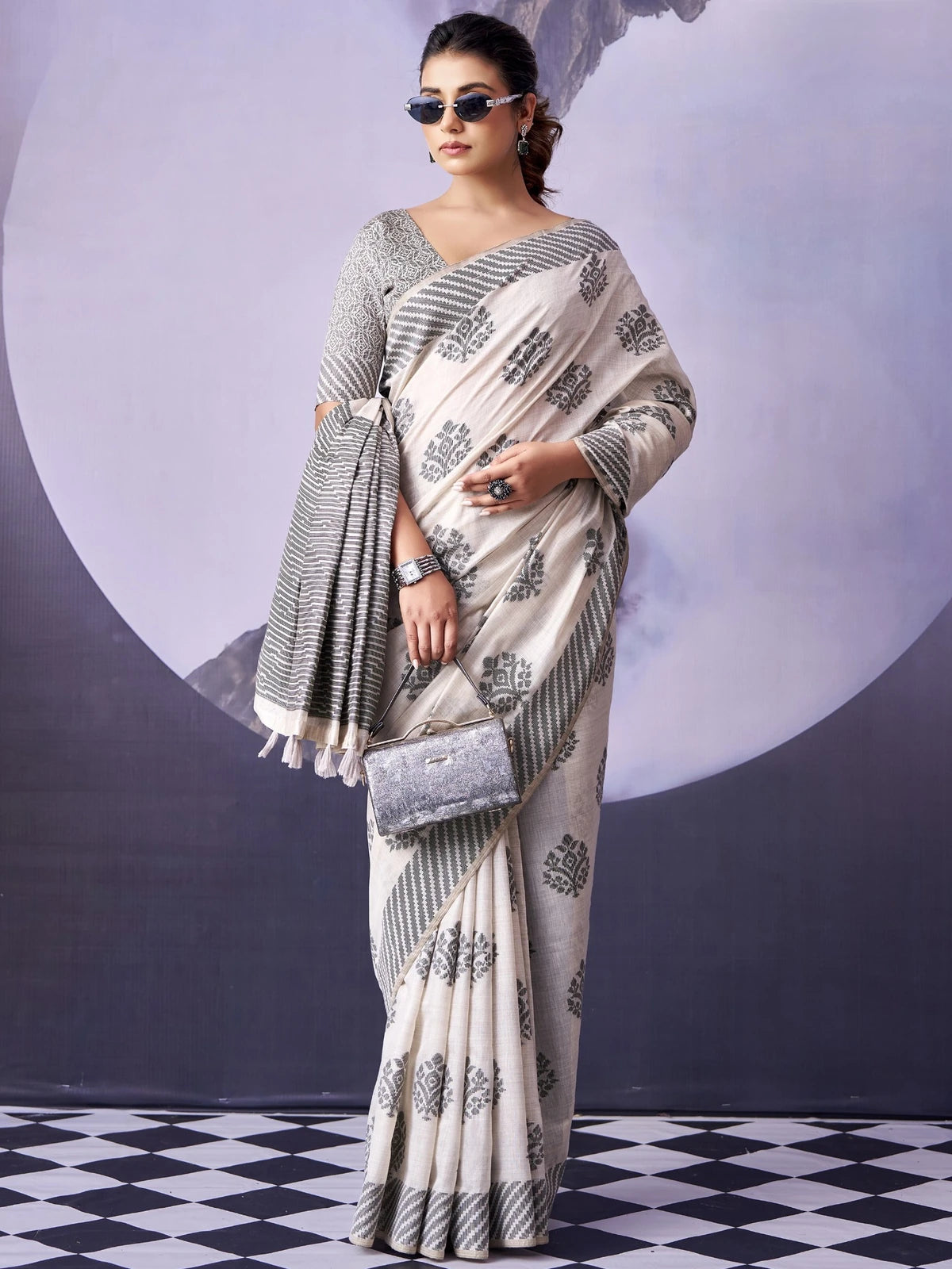 Tarani off white fancy premium cotton saree front view with elegant woven pattern