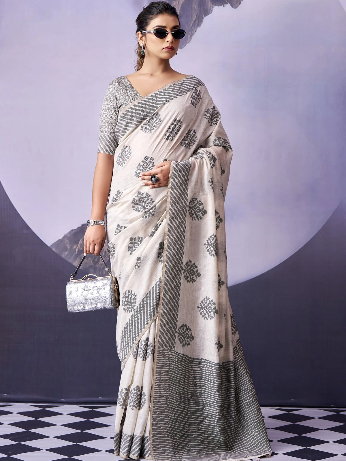 Tarani off white fancy premium cotton saree full view with woven motifs and matching blouse