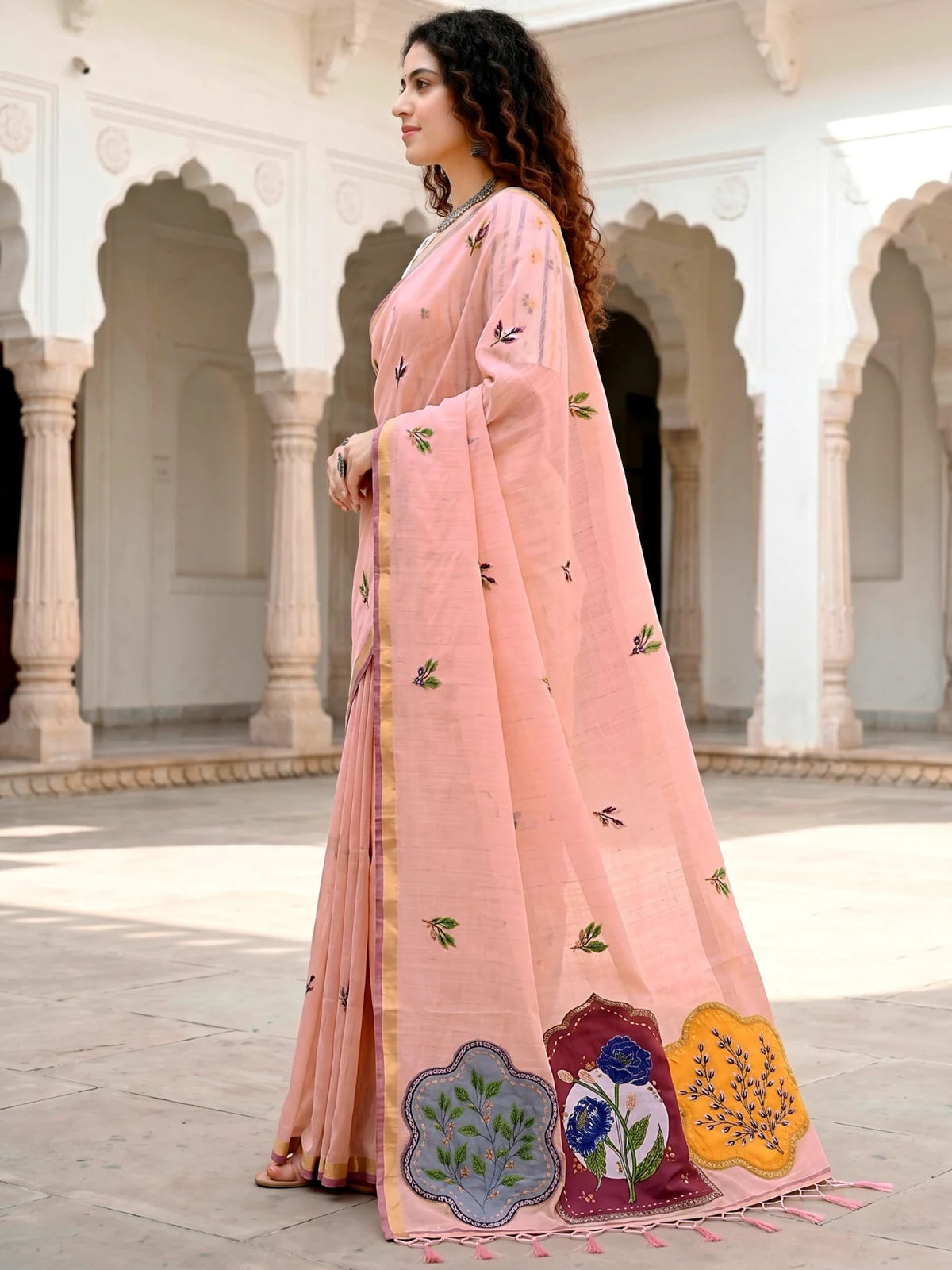 Tarani Nehika peach cotton saree side view with woven floral detailing and pallu border