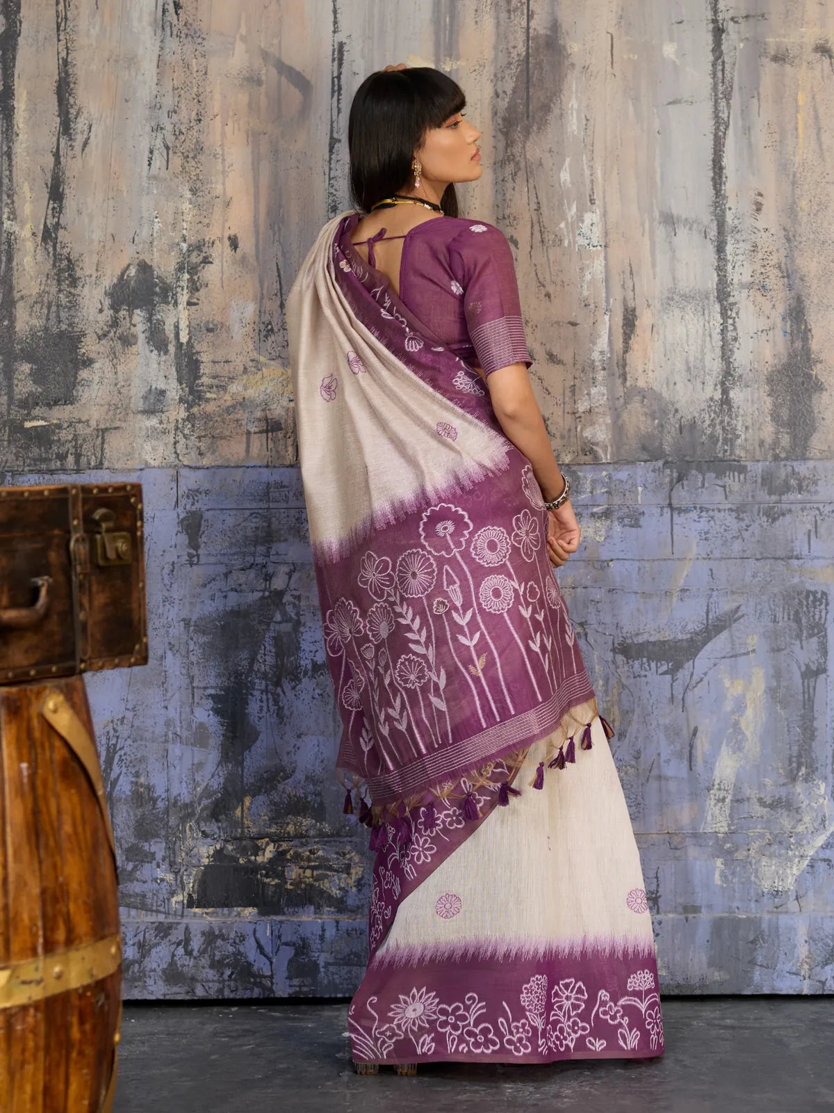 Tarani back view of purple handloom cotton saree showing intricate pallu fall and blouse tie