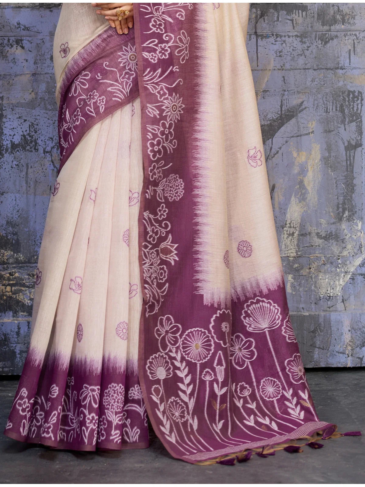 Tarani pallu view of purple floral border cotton saree with elegant motifs and texture