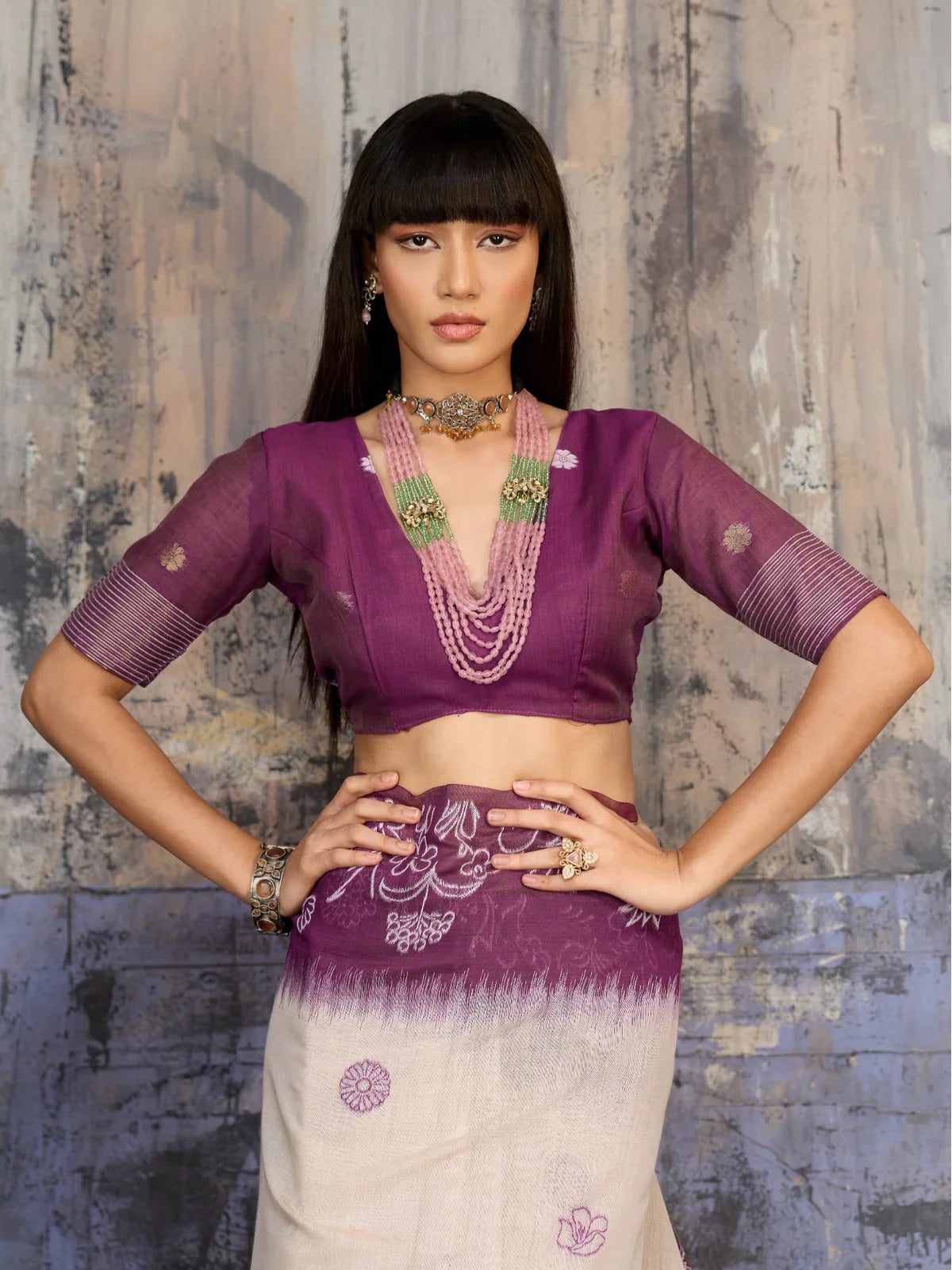 Tarani upper body view of handloom cotton blouse in rich purple paired with embroidered saree