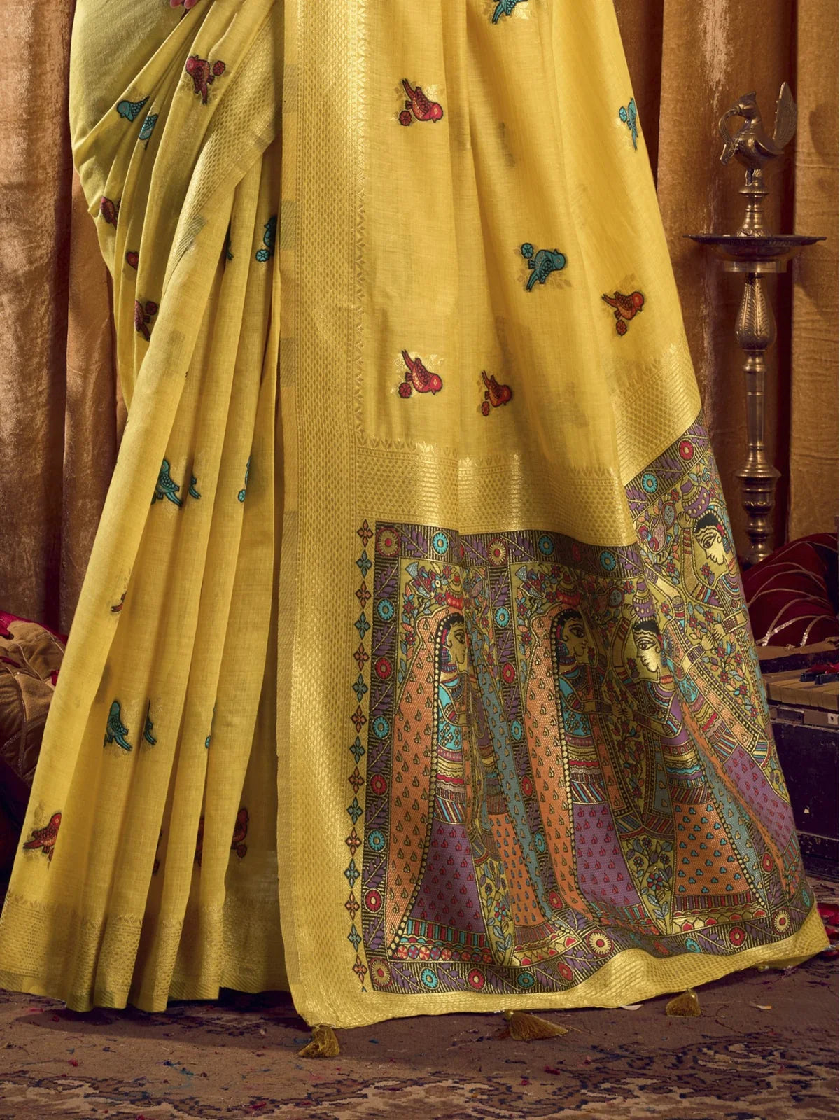 Tarani cotton saree yellow pallu with colorful Madhubani-inspired artwork closeup