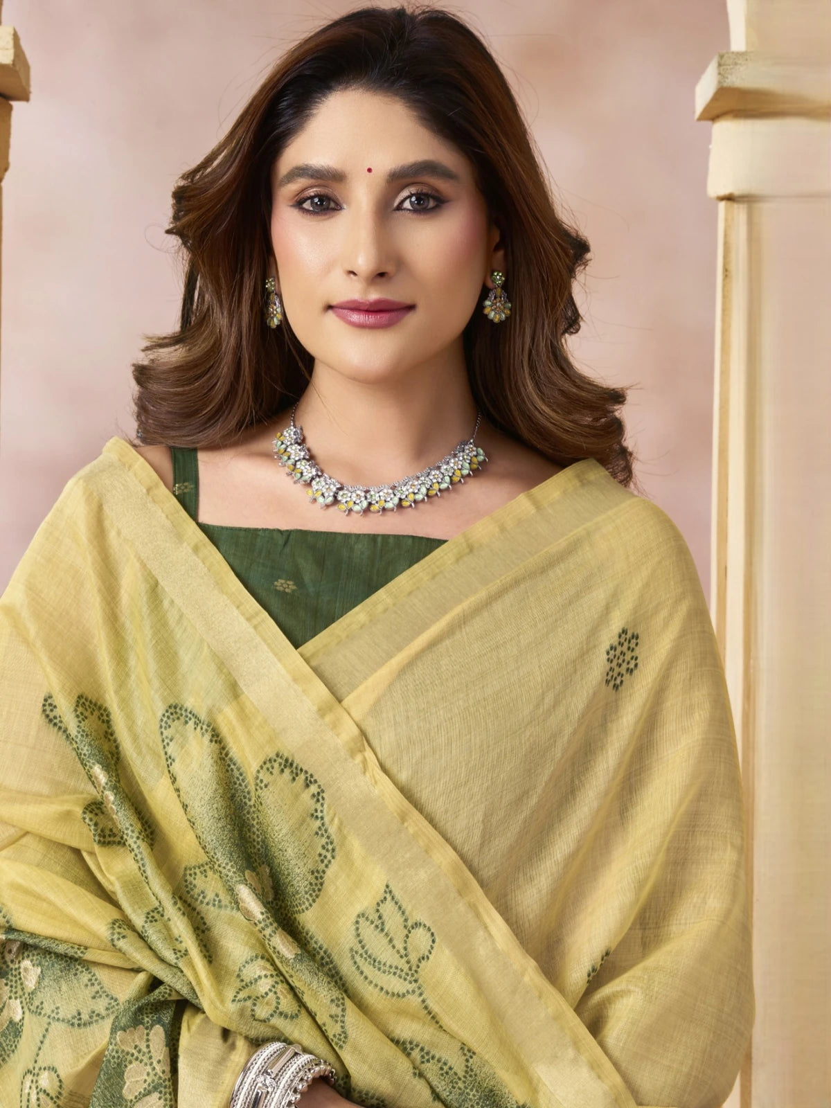 Tarani Siddhi yellow cotton saree with green blouse and floral detailing upper body view