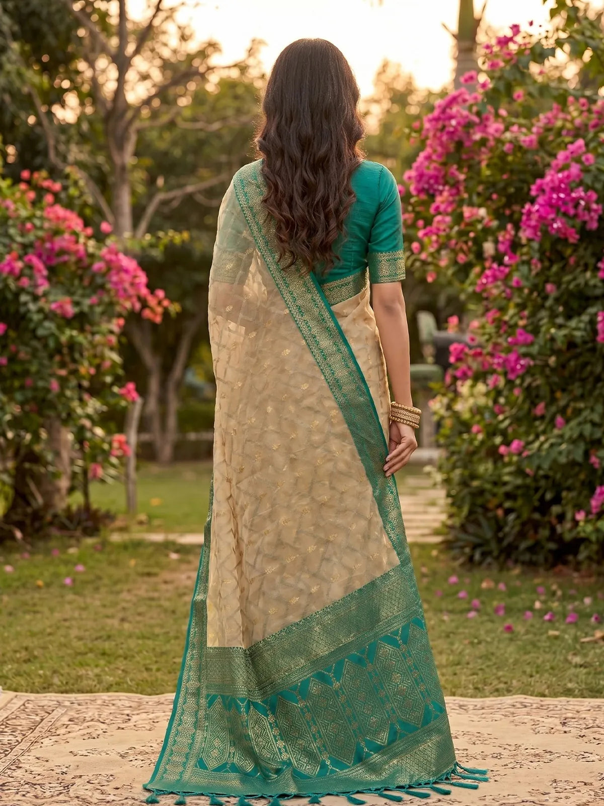 Tarani beige cotton silk zari border saree back view with rich teal woven pallu