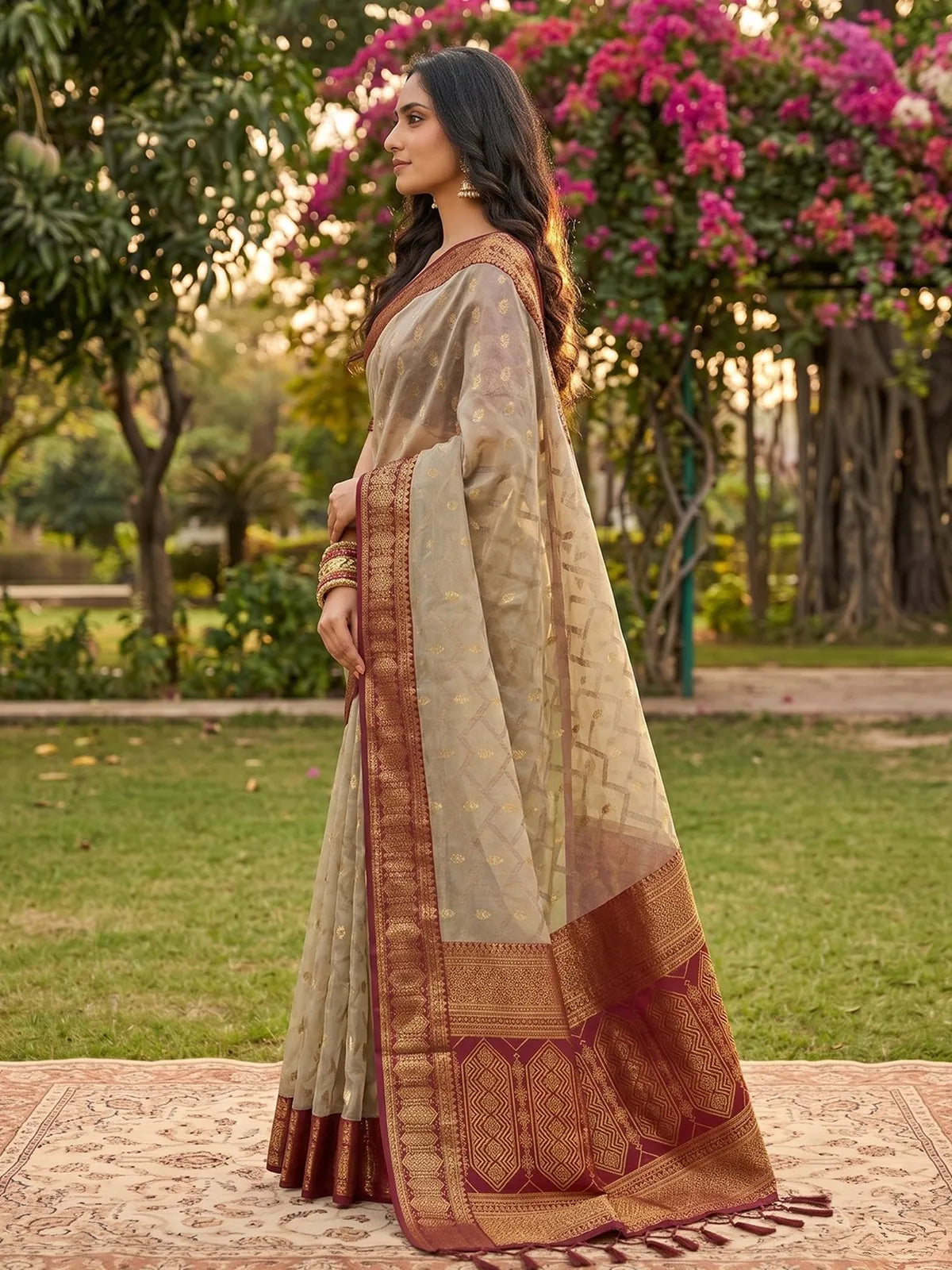 Tarani beige and brown cotton silk zari border saree side view with elegant festive drape