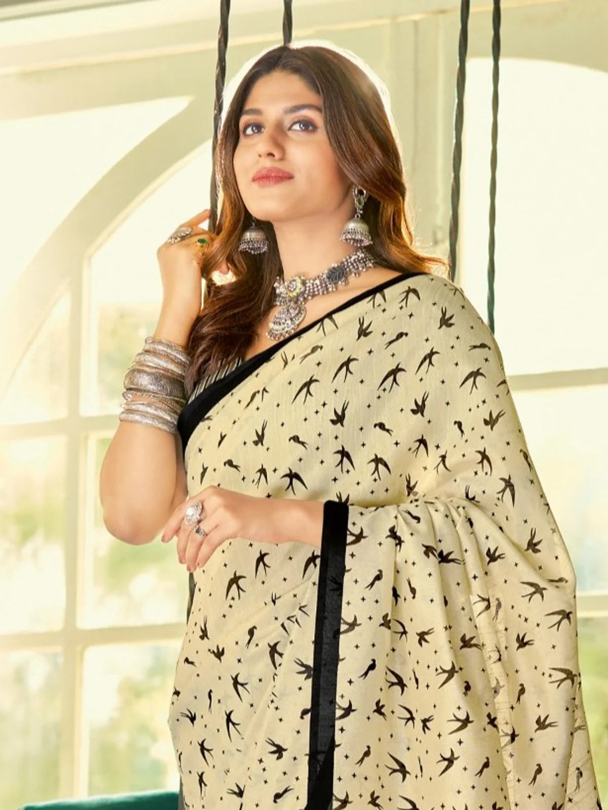 Tarani beige cotton silk saree upper body view showing elegant bird pattern and jewellery styling