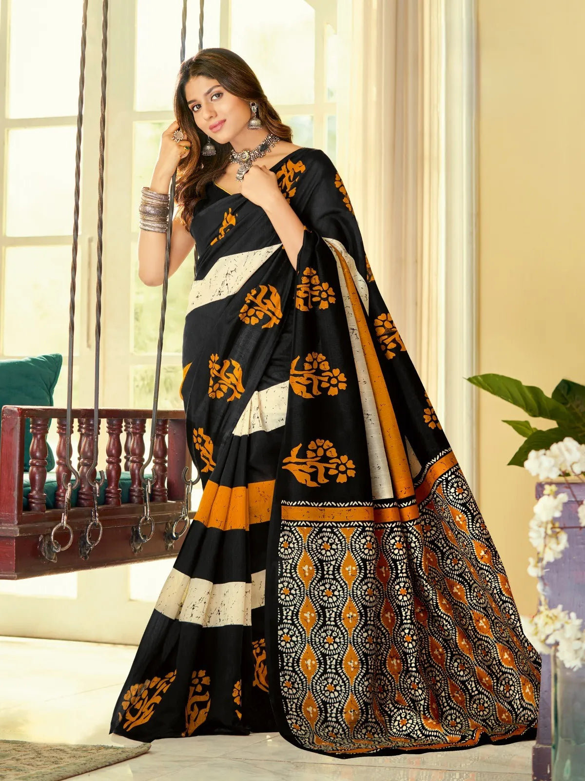 Tarani premium black cotton silk saree with mustard block print and intricate border for festive occasions