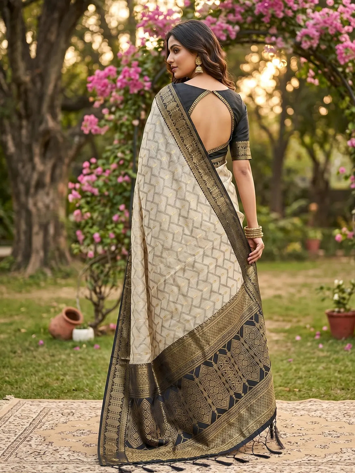 Tarani beige and black cotton silk zari border saree back view with detailed pallu and blouse design