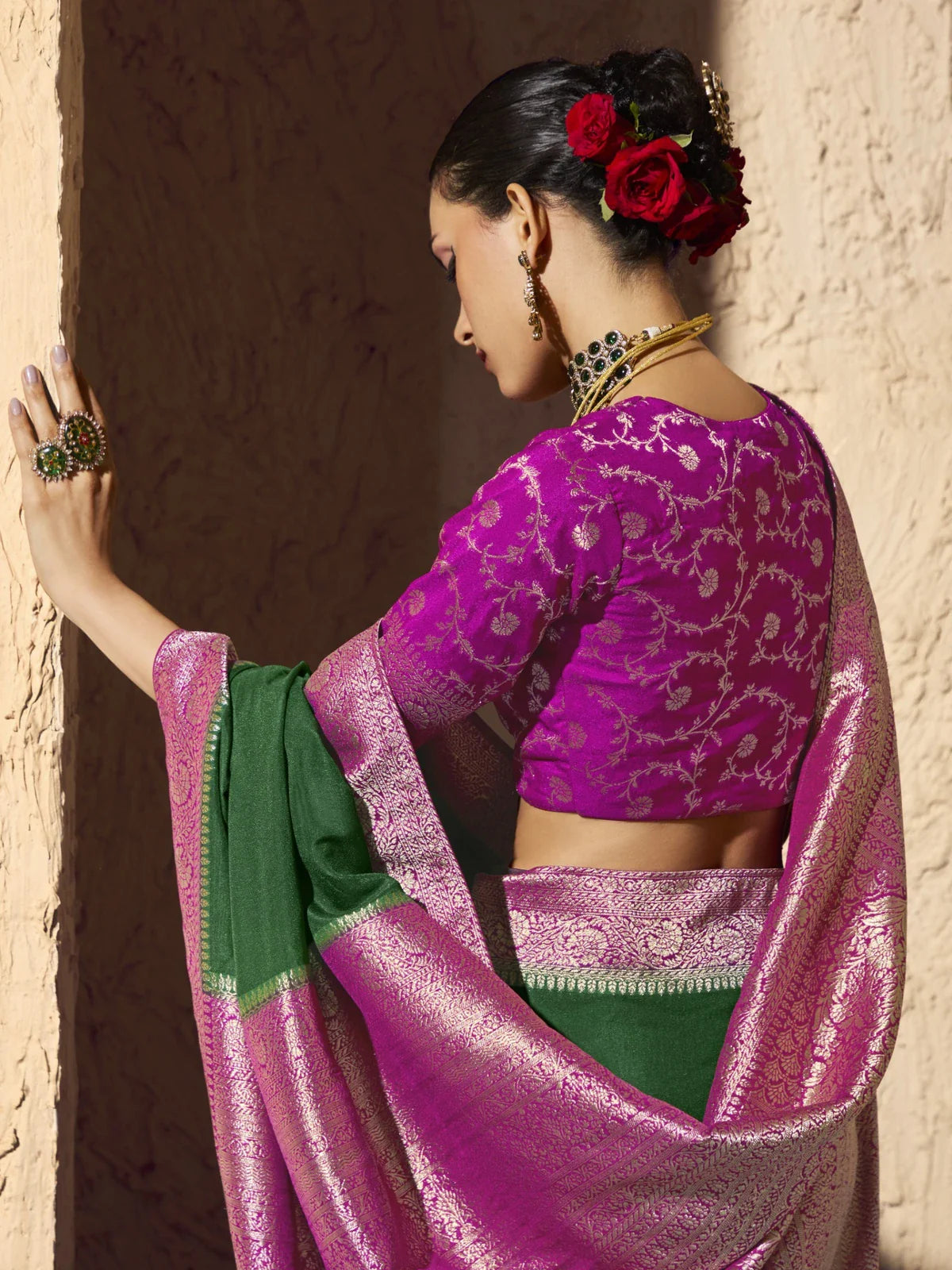 Tarani designer saree back blouse view showing floral zari work and elegant drape