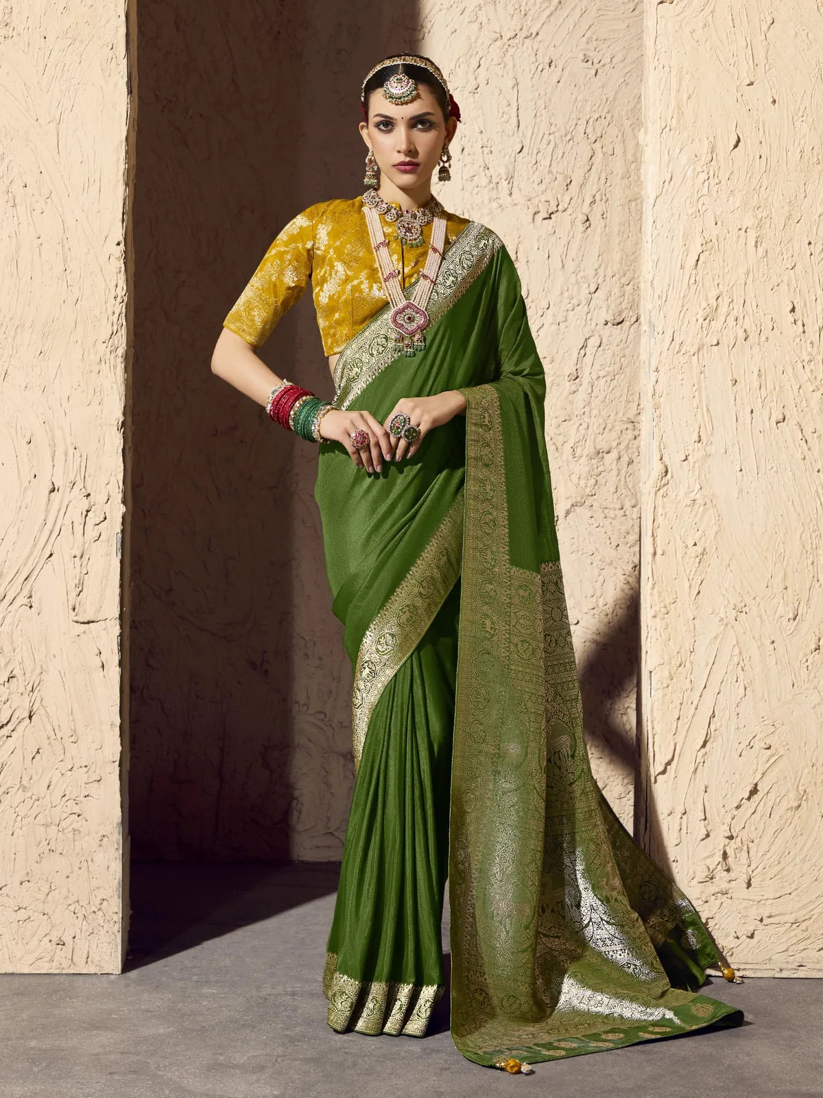 Tarani premium green crepe georgette saree with zari border and blouse for festive occasions