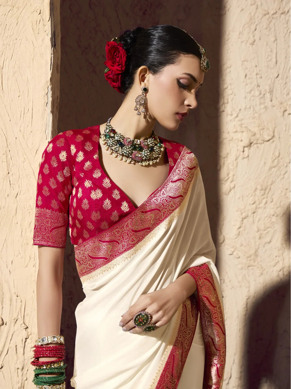 Tarani upper body shot of off white crepe georgette saree with maroon embroidered blouse