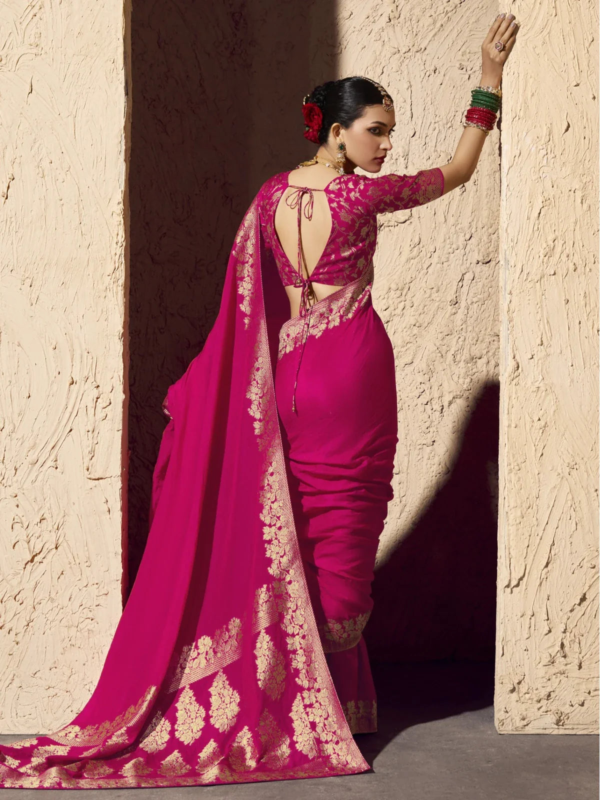 Tarani pink saree full back view with blouse knot style and festive drape