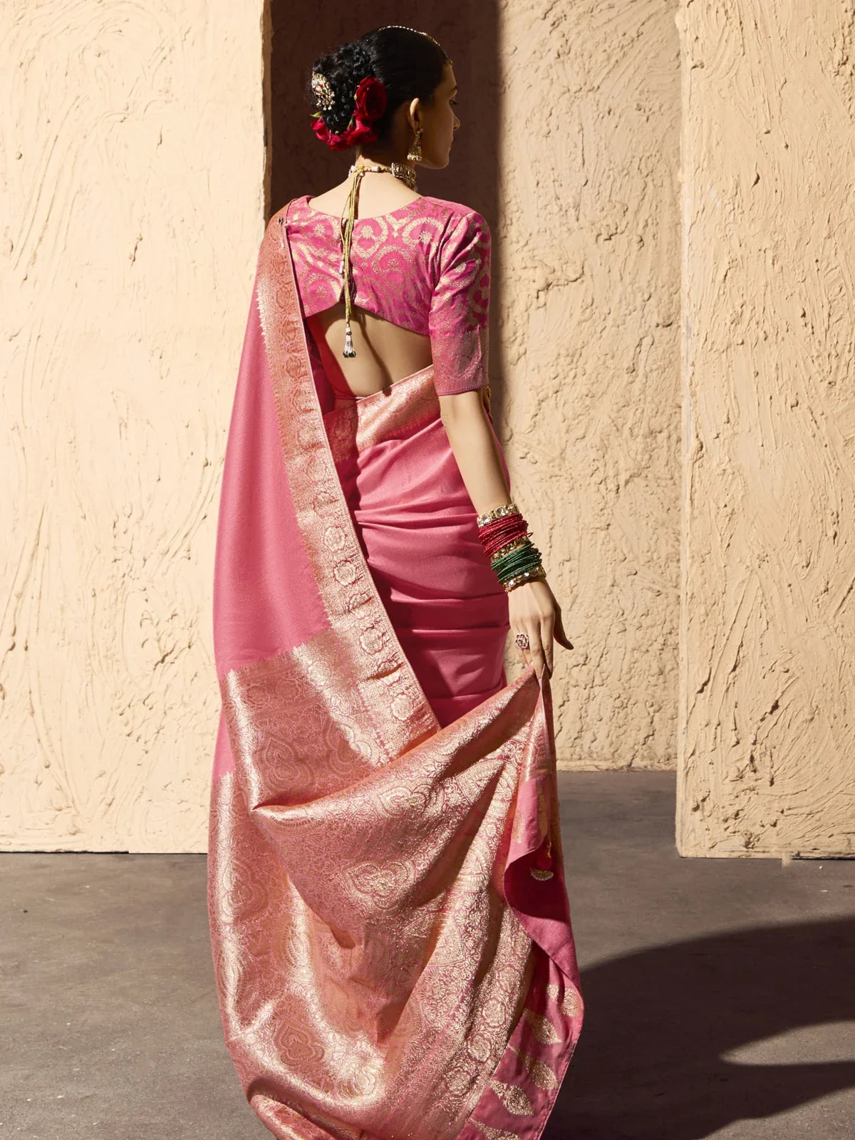 Tarani pink georgette saree full back view showing pallu design and blouse back cut pattern