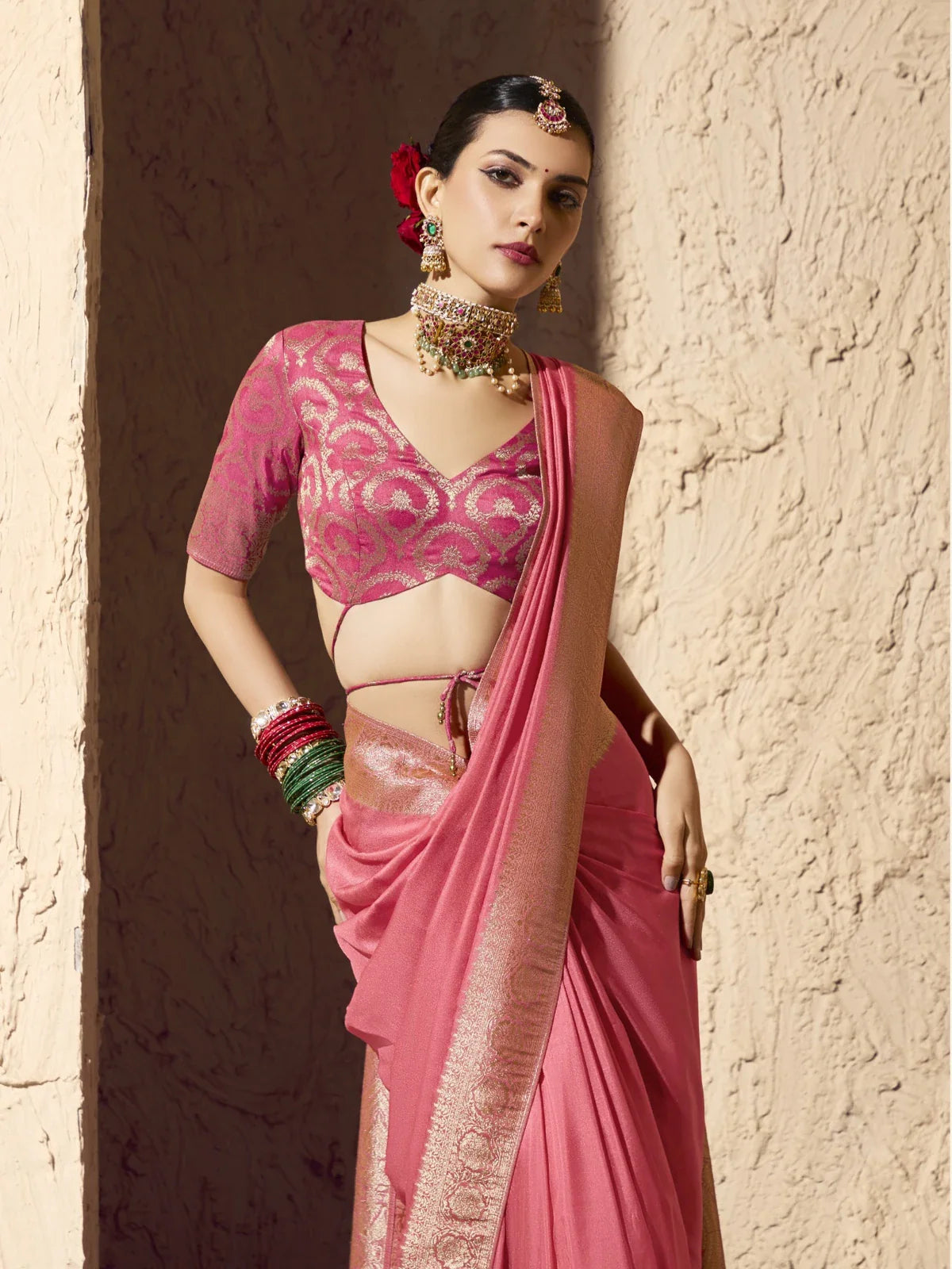 Tarani premium pink crepe georgette saree close-up of embroidered blouse and neckline styling