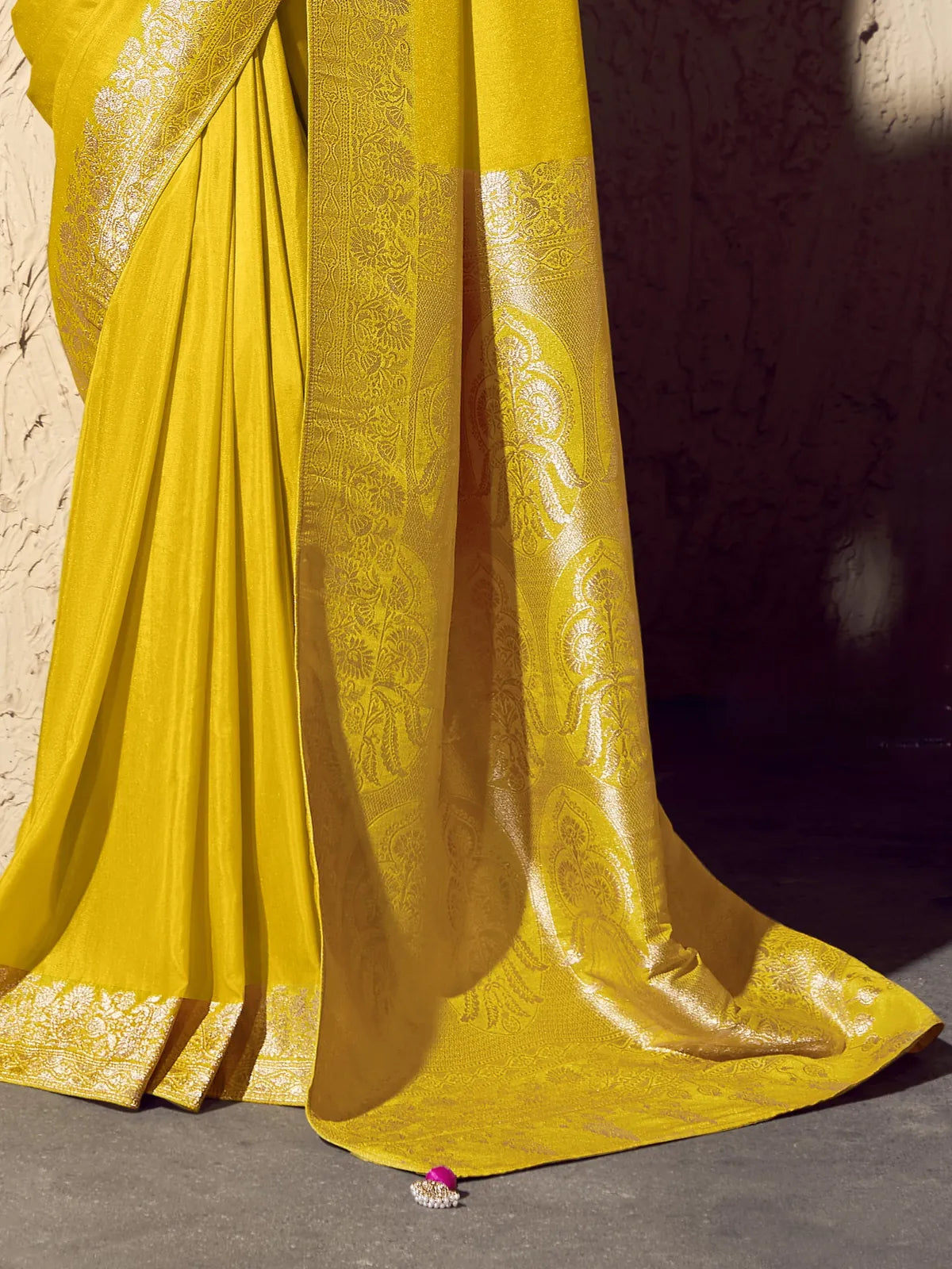 Tarani yellow crepe georgette saree showing zari woven pallu and intricate detailing