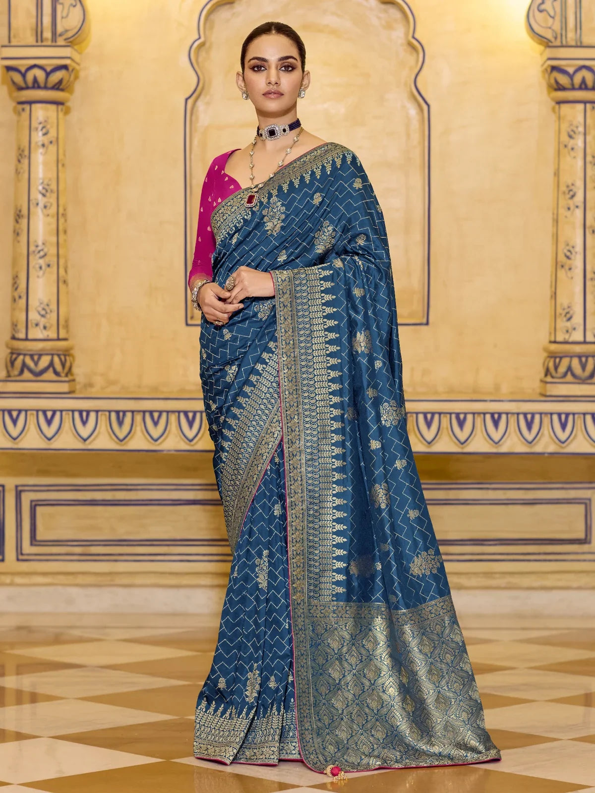 Tarani blue crepe silk saree full view with zari work and magenta blouse for festive wear