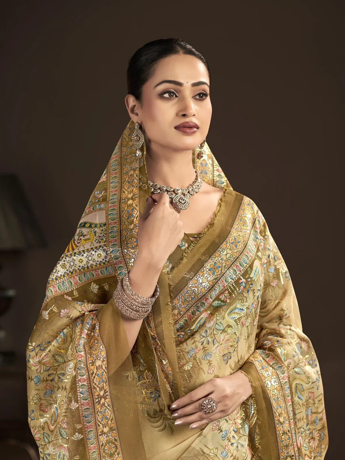 Tarani golden crepe saree upper body view with matching blouse and traditional jewellery