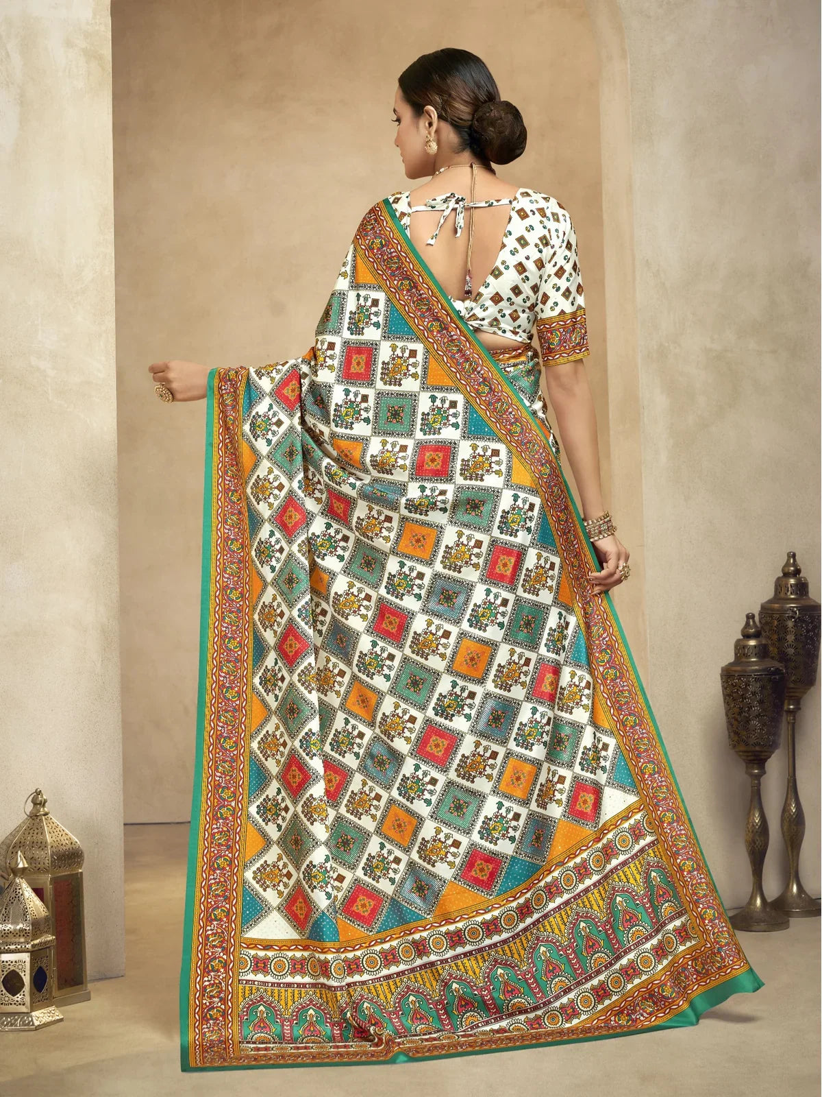 Tarani multicolor crepe saree showcasing back blouse design and pallu work in back-view
