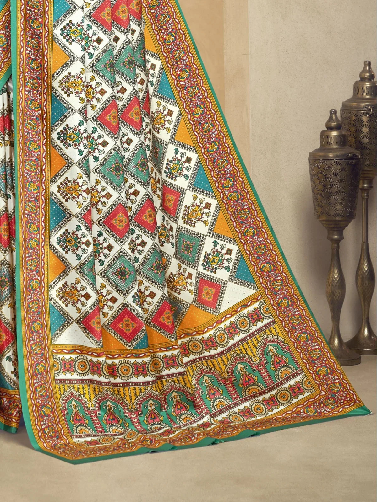Tarani digital print crepe saree with ethnic detailing in vibrant colors shown in closeup view