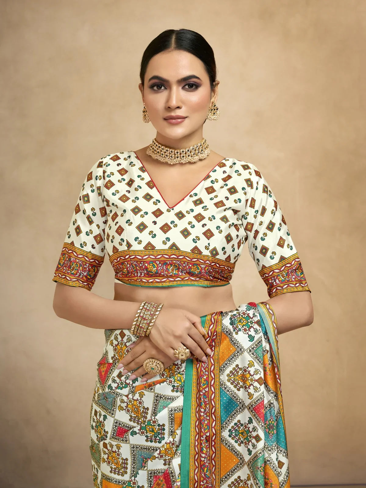 Tarani crepe saree close-up showing blouse with foil print and zari style motifs in upper-body-view