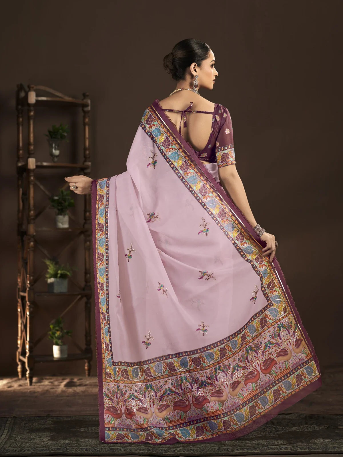 Back view of Tarani pink crepe saree with blouse and traditional pallu flow