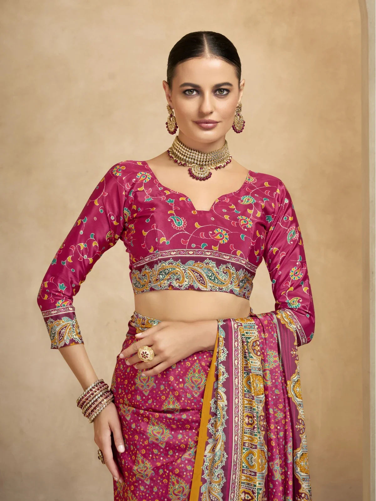 Tarani festive pink saree upper body closeup with printed crepe blouse