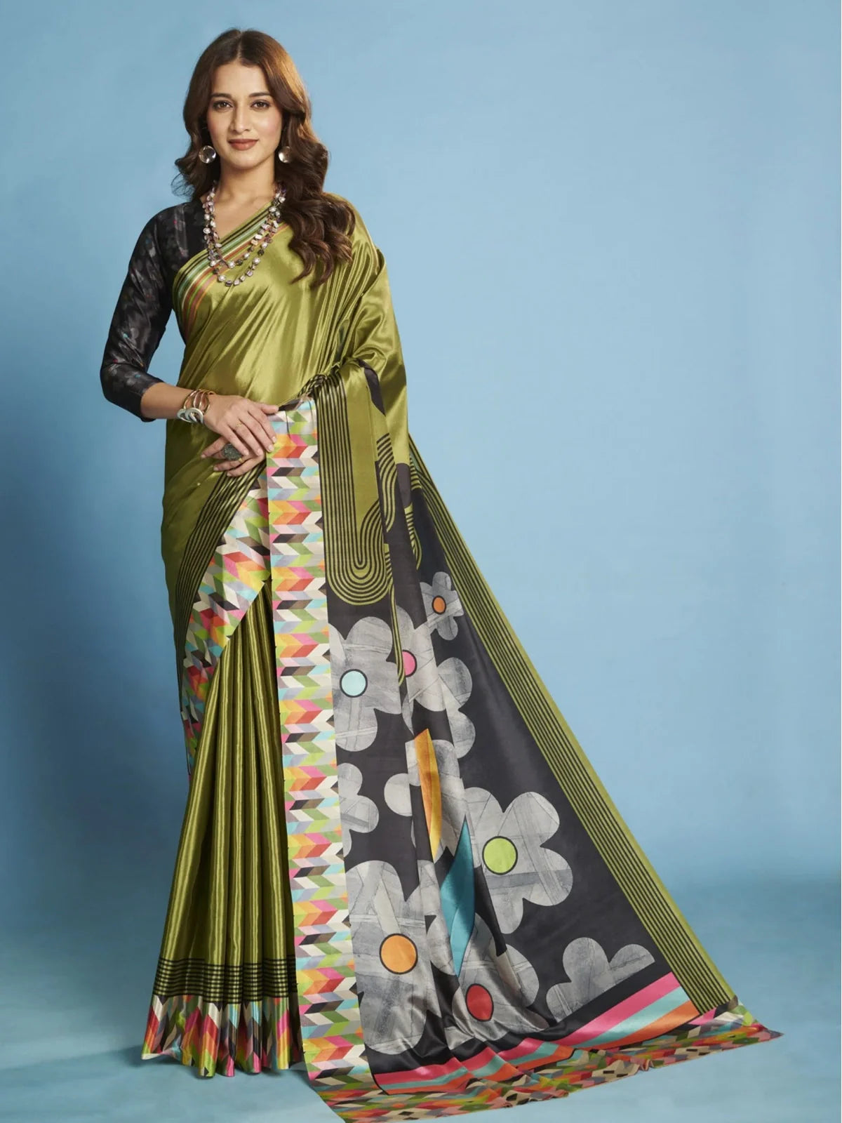 Tarani green crepe silk saree with geometric border and floral pallu perfect for party and festive wear