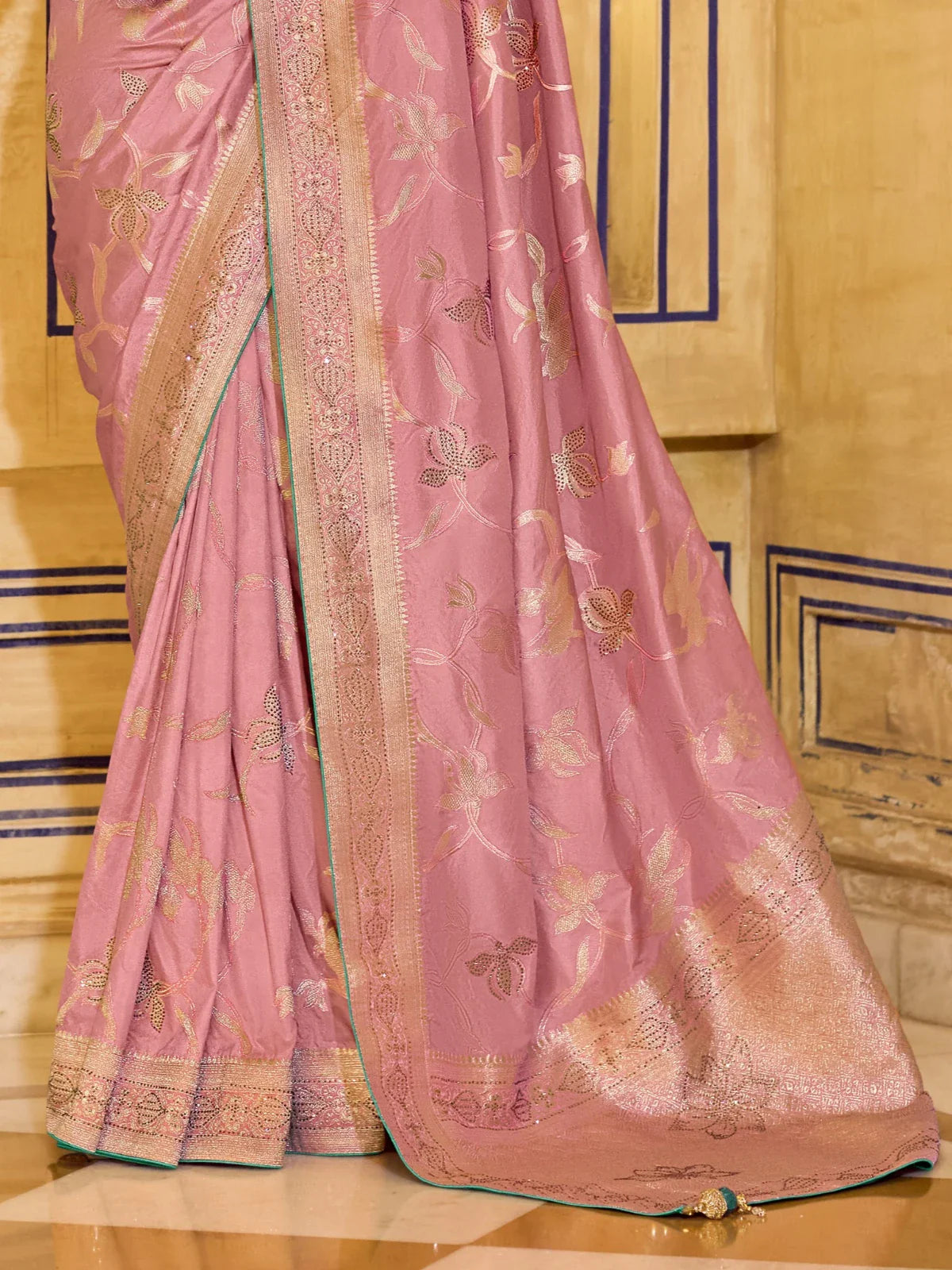 Tarani crepe silk saree in soft pink with zari woven pallu and border shown in detailed pallu view