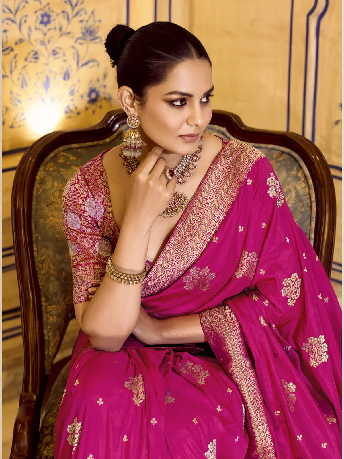 Tarani pink crepe silk saree with matching blouse and heavy earrings upper body view