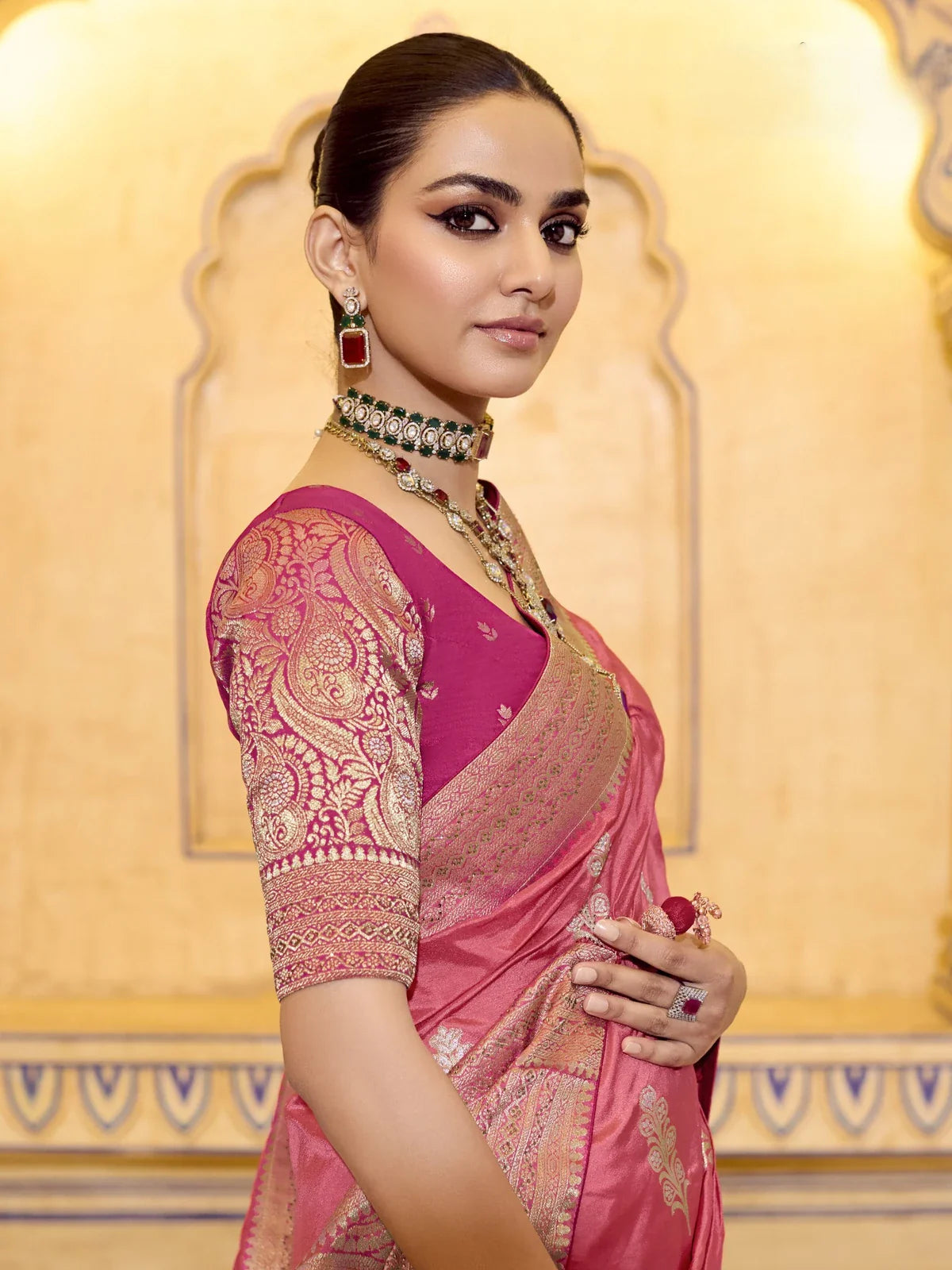 Tarani festive pink saree close-up showing embroidered blouse and neckline