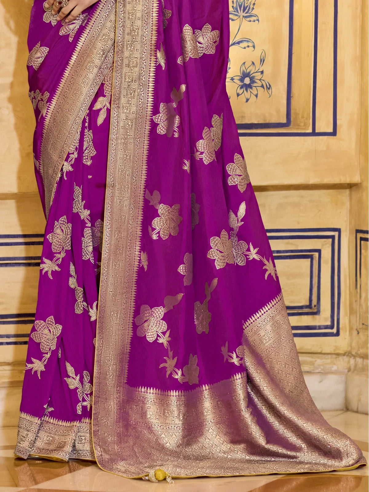 Tarani close-up of purple crepe silk saree pallu with zari woven floral motifs and border
