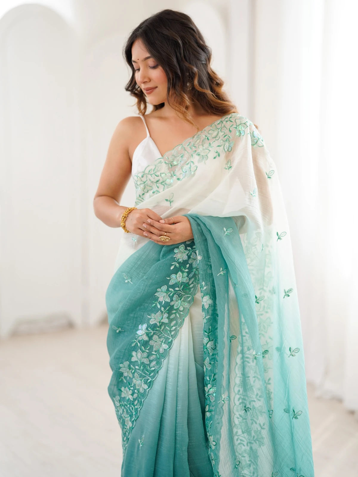 Tarani green crunchy saree upper body view with embroidered border and satin silk blouse