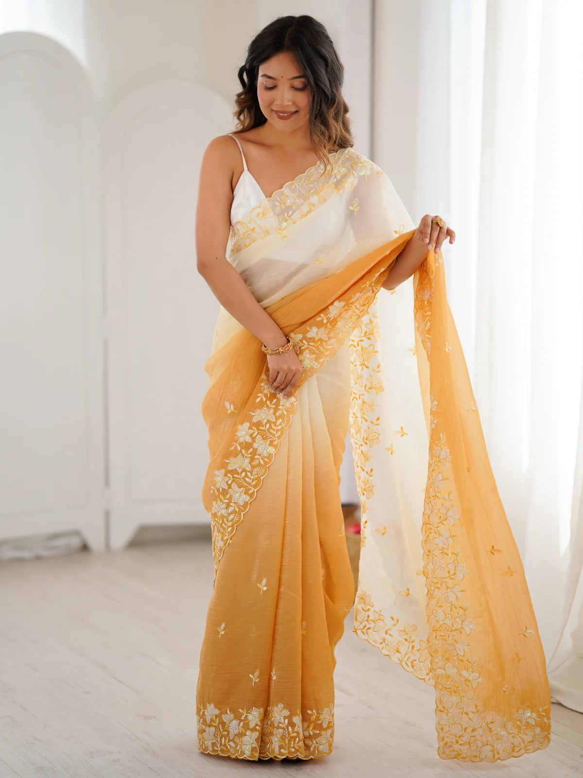 Tarani Geetali mustard party wear saree front view with sequence embroidery floral border