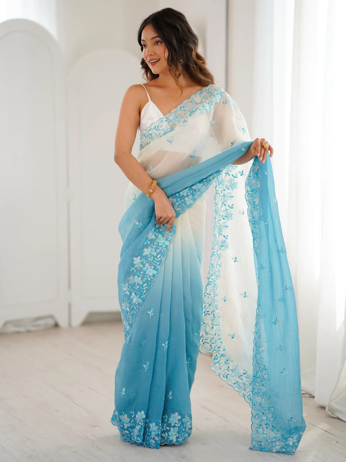 Tarani Samata front view sky blue ombre saree with sequence embroidery pallu