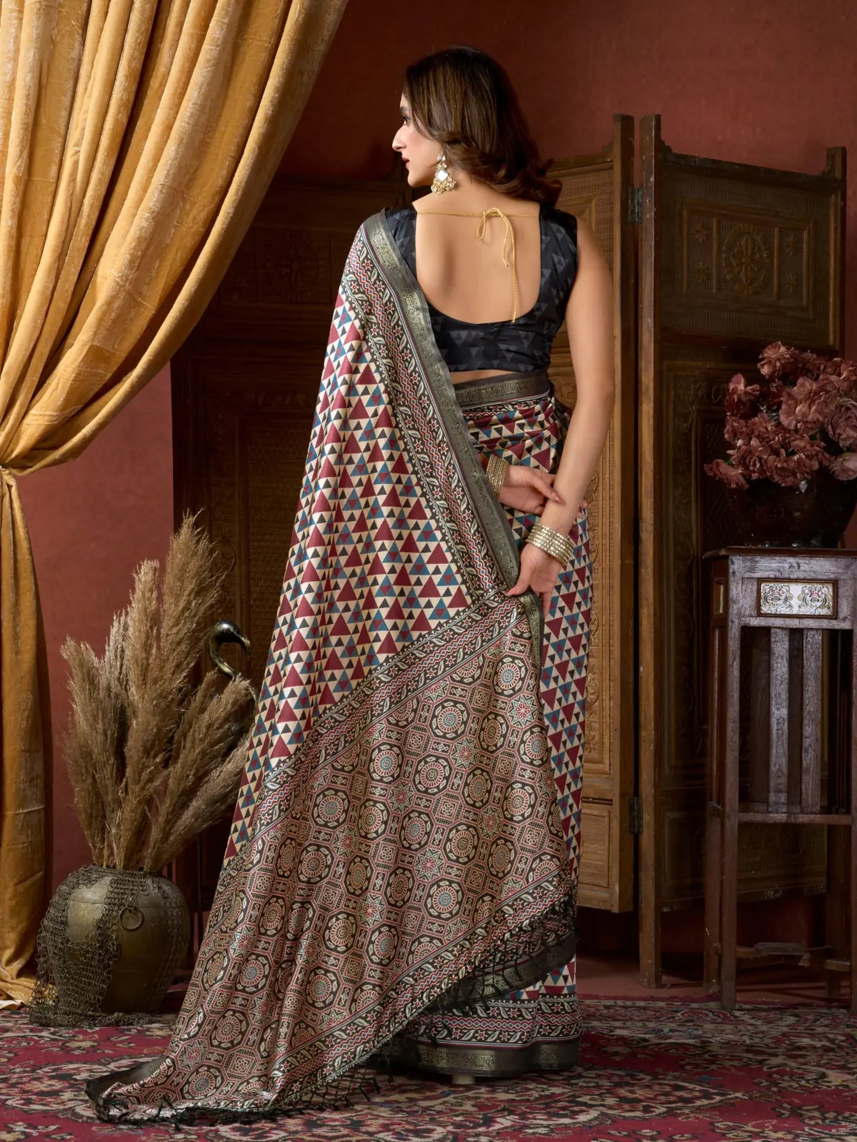 Back pose of Tarani digital maroon saree with elegant drape and jhallar finish