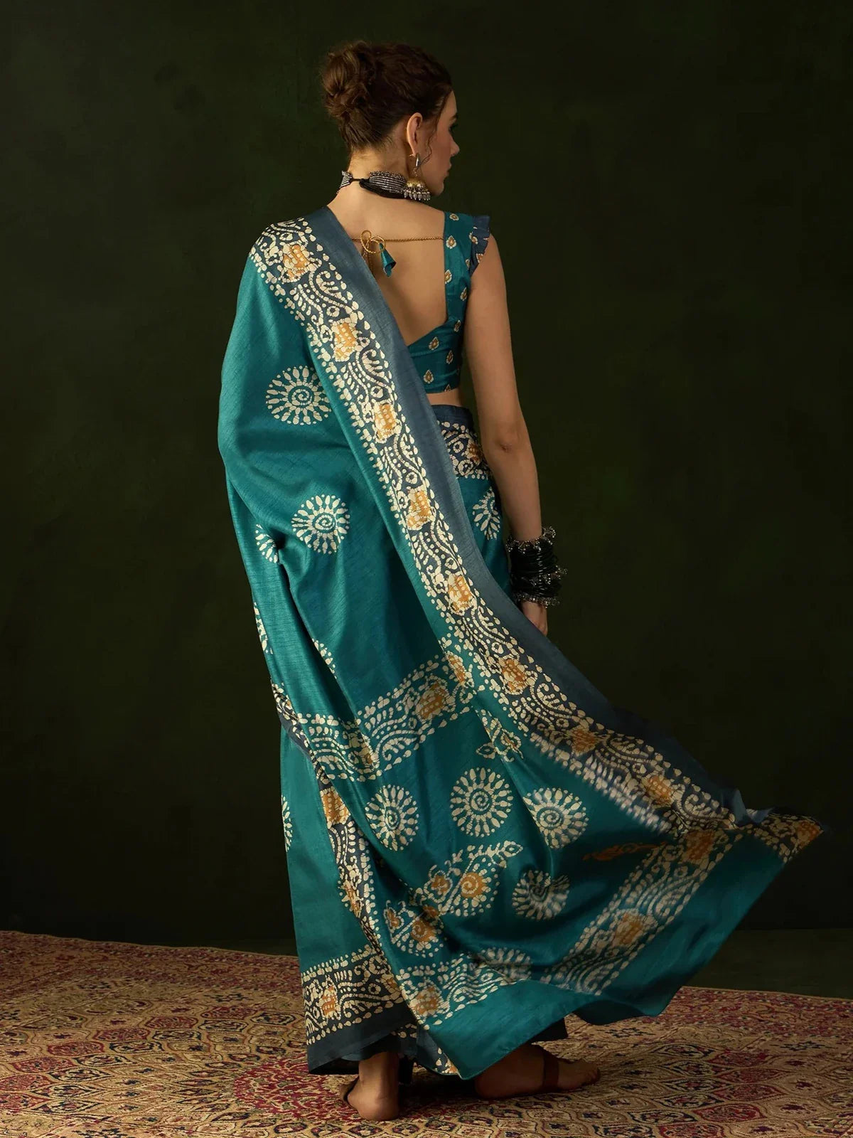 Tarani Dola silk saree back view showcasing elegant border and pallu