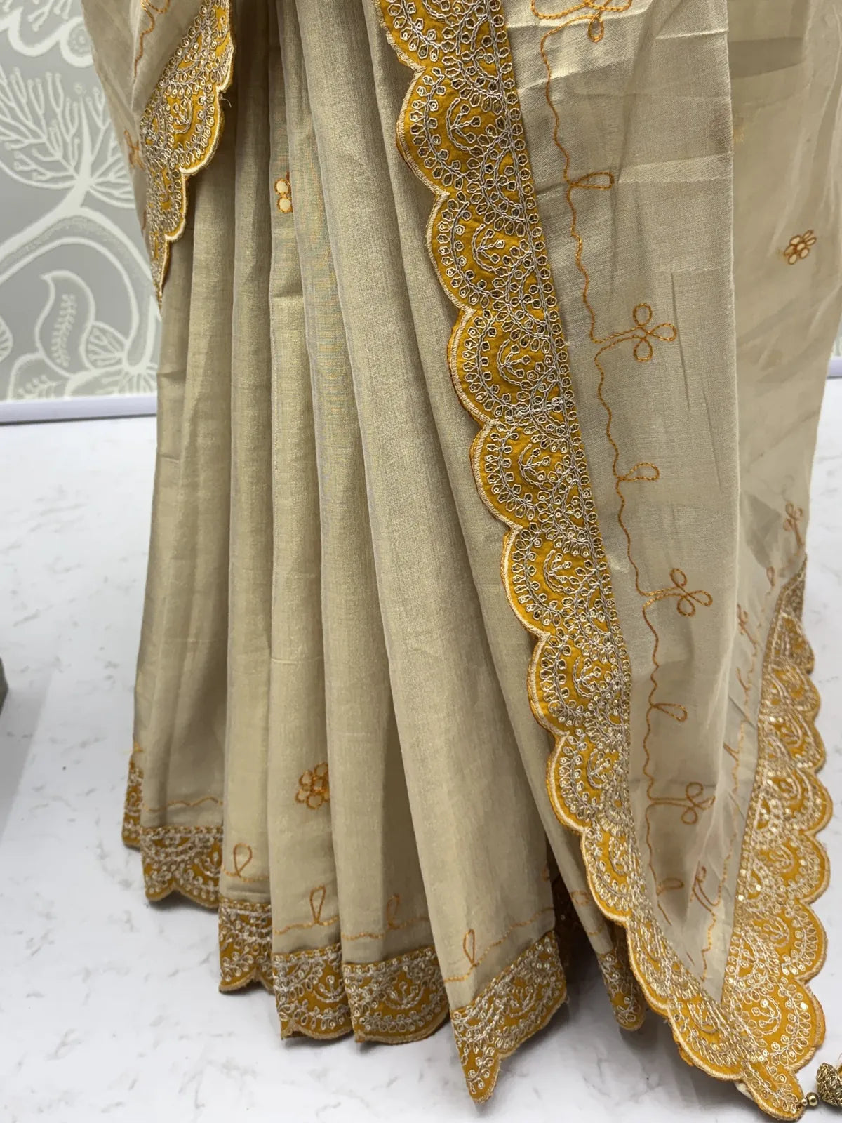 Tarani closeup view of mustard saree border with dori work and gotta pati embroidery detailing