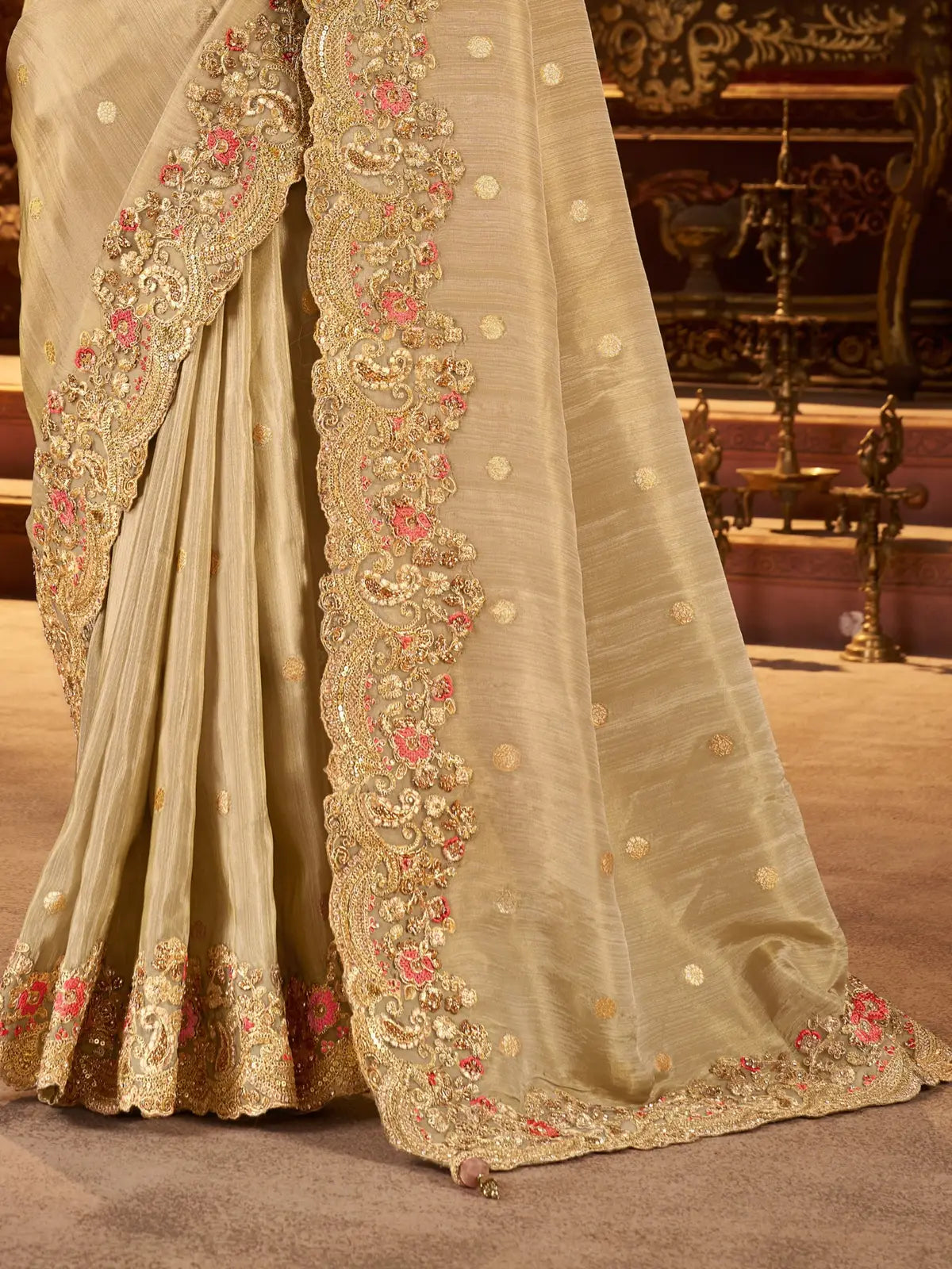 Tarani pallu view highlighting zari embroidery and latkan detail on beige saree