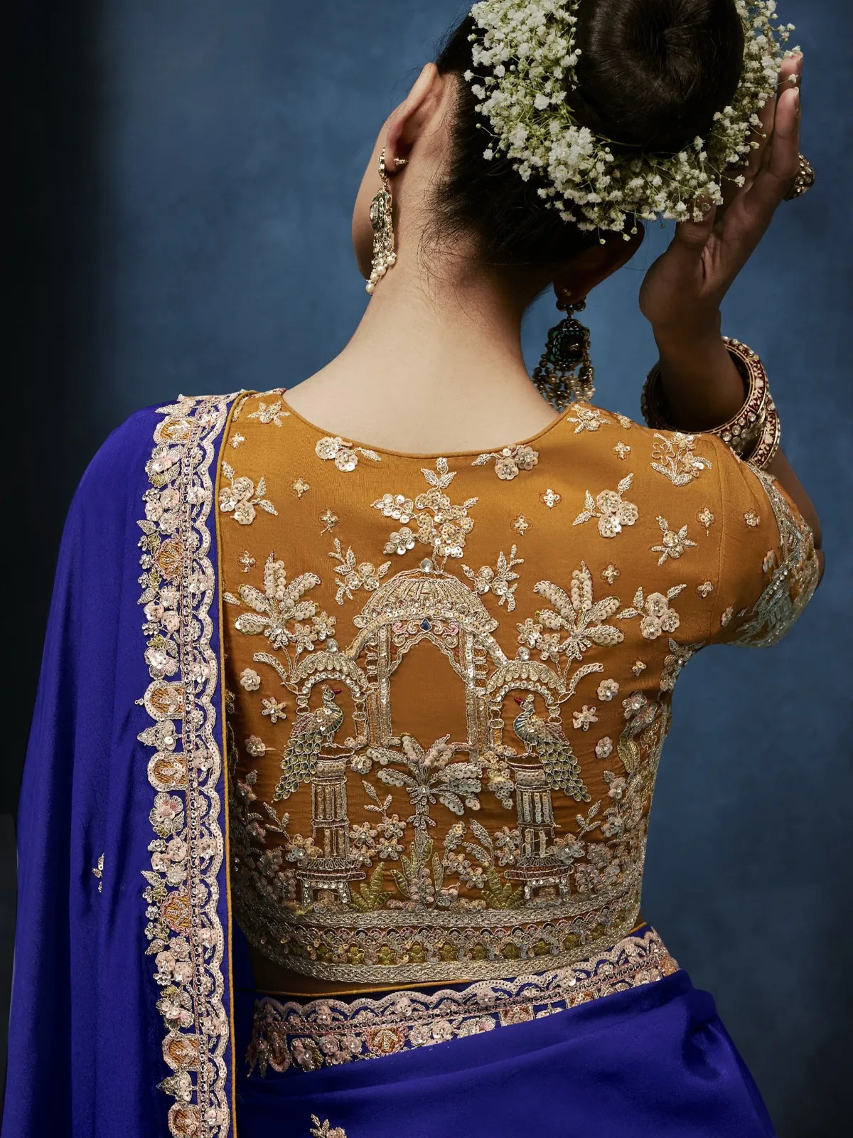 Tarani royal blue fancy saree back blouse view with intricate khatli embroidery work