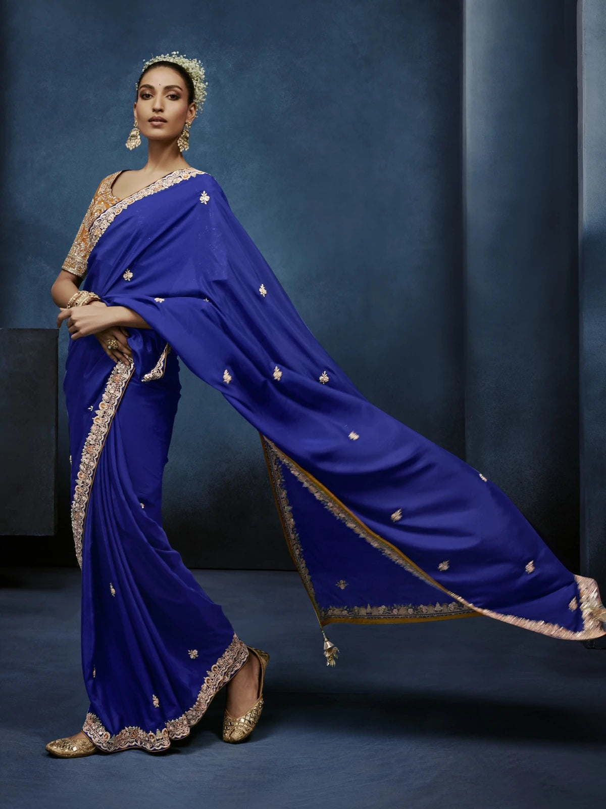 Tarani royal blue fancy saree pallu view with elegant embroidered border and flowing drape