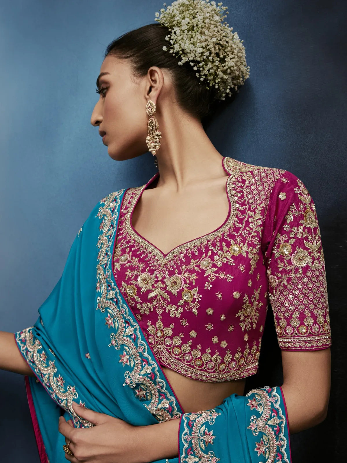 Tarani blue designer saree side view with detailed embroidered blouse and border work