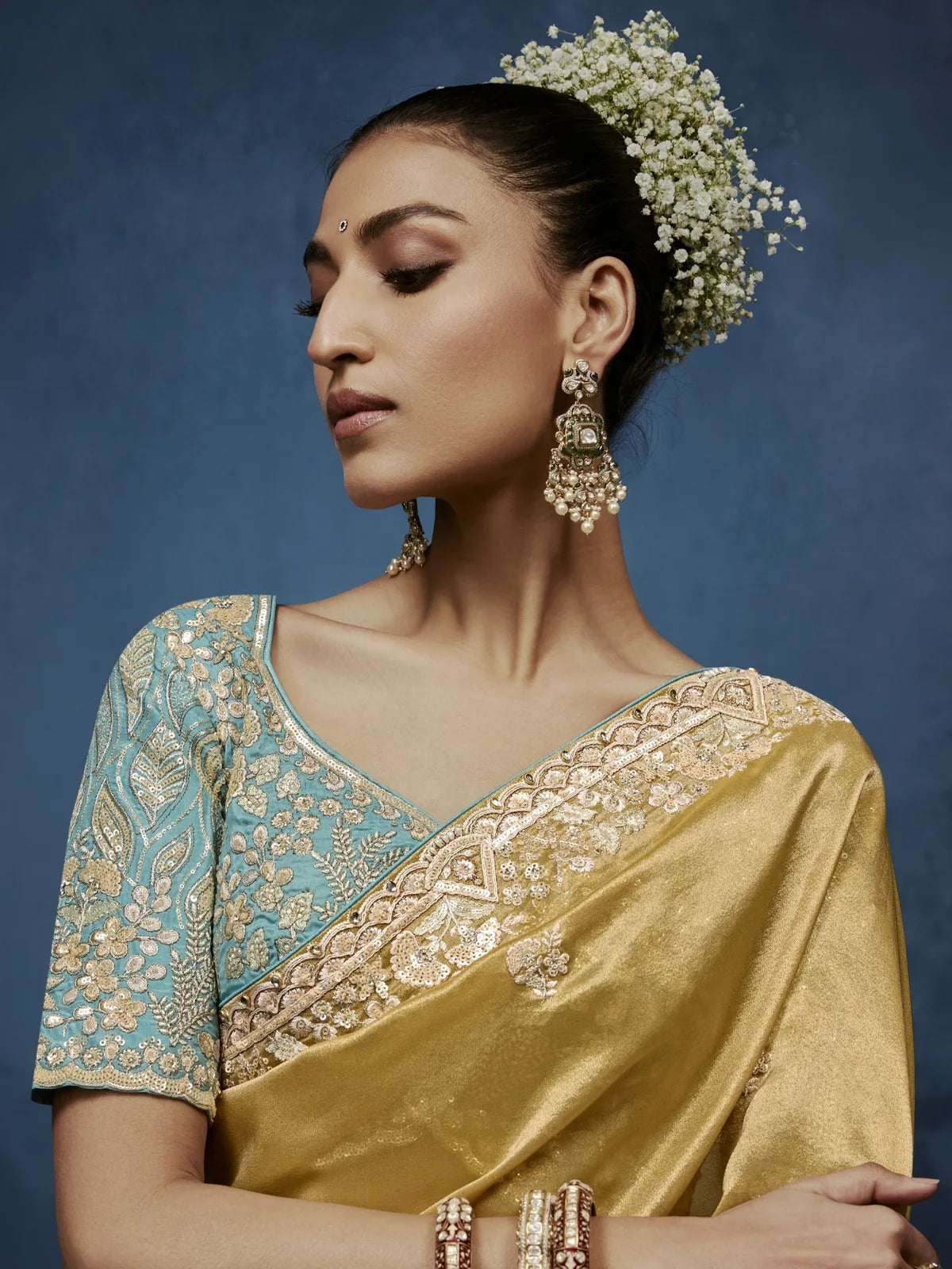 Tarani golden fancy saree upper body view with premium embroidered blouse and elegant detailing