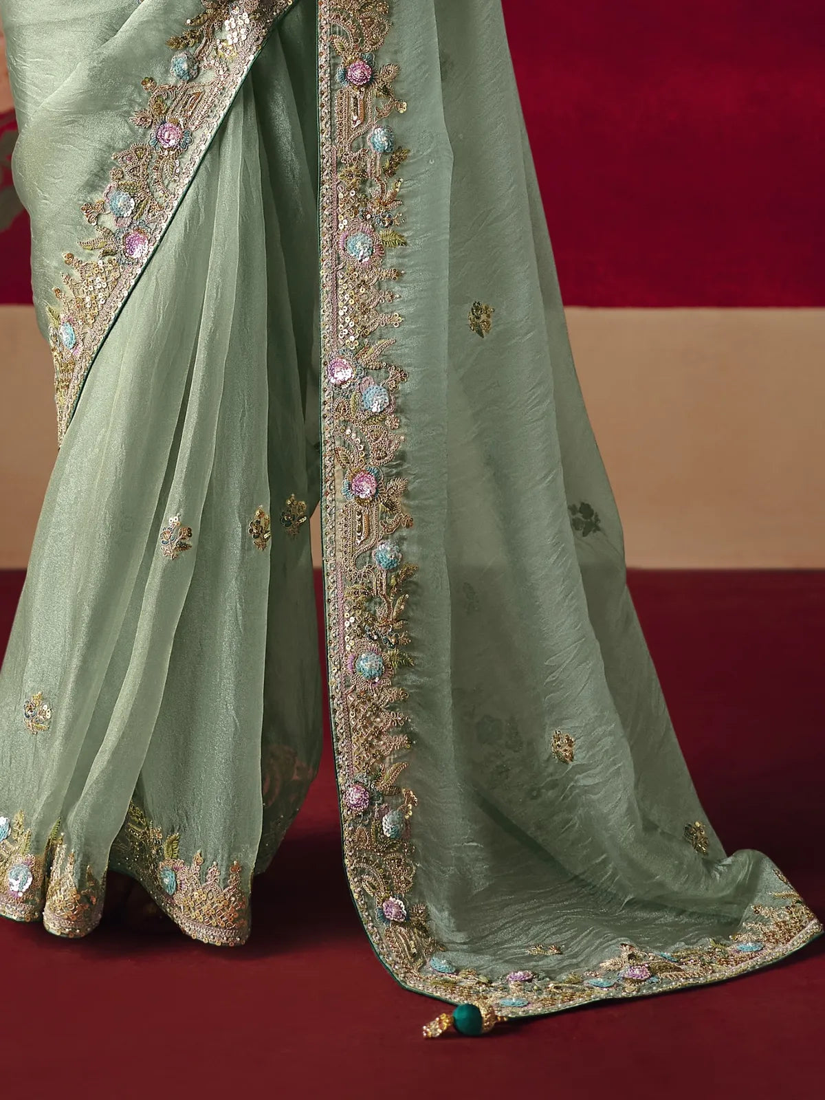 Tarani green saree closeup view showing rich work and border details