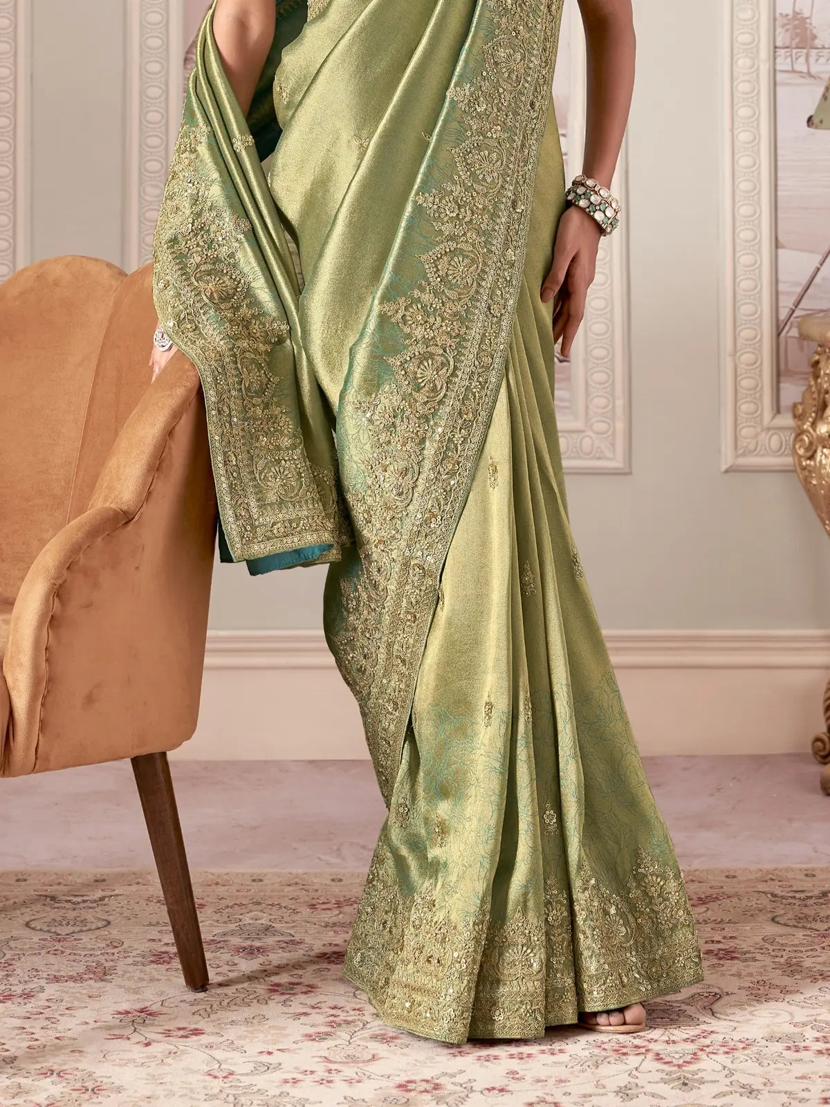 Tarani green fancy saree pallu view with intricate border detailing and hand work design