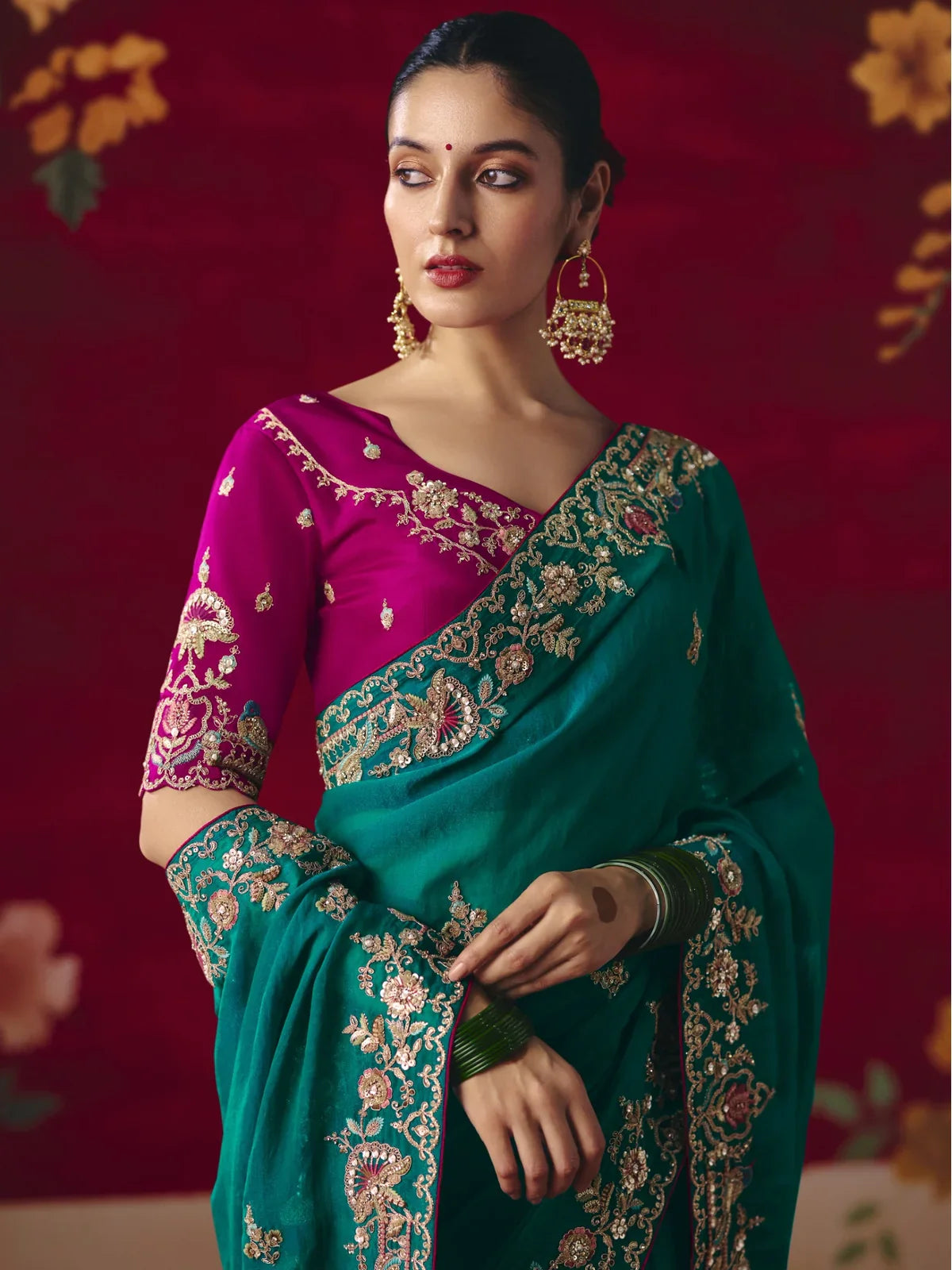 Tarani premium embroidered green saree upper body look with magenta sleeve blouse and traditional styling