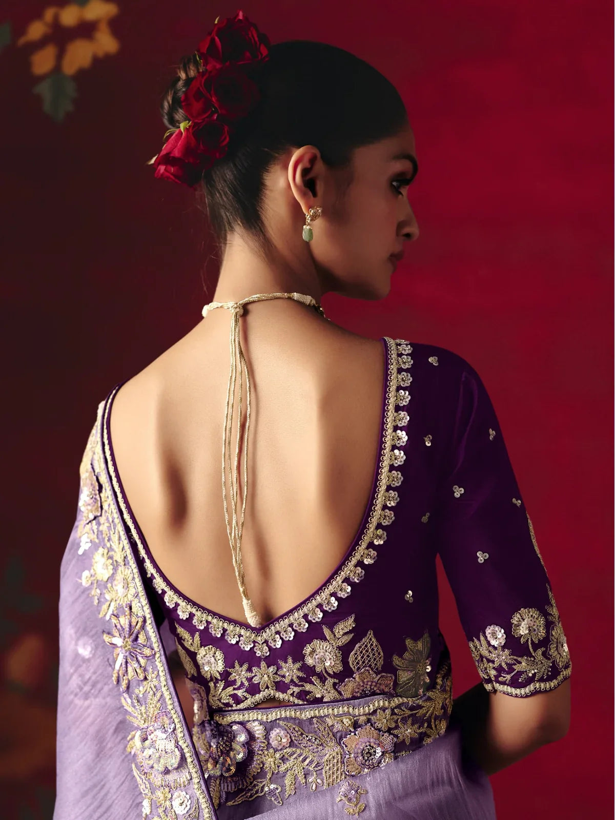 Tarani back blouse view with deep neckline and heavy floral embroidery for festive occasions