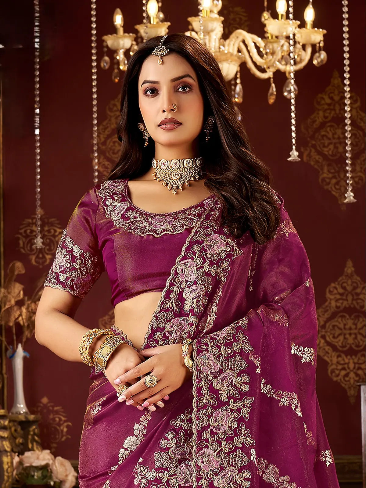Tarani magenta party saree with floral embroidered blouse and zari work upper body closeup
