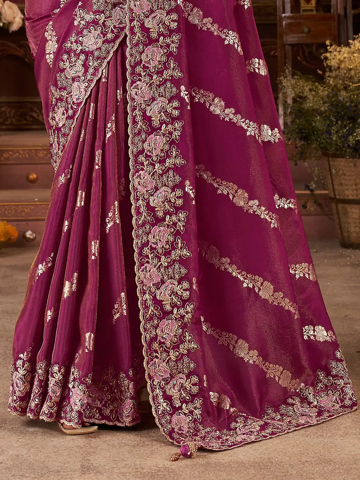 Tarani magenta saree intricate border embroidery and latkan pallu detailed fabric closeup
